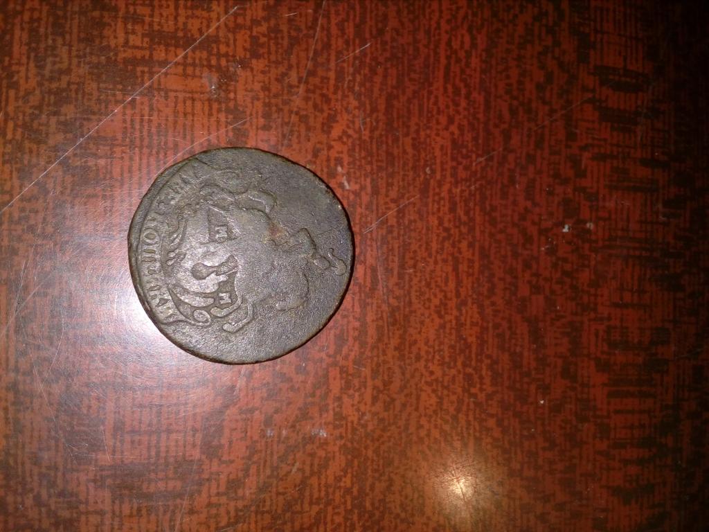 Старинная манета (обратная сторона)