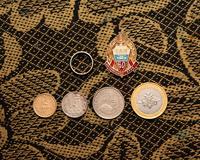 Монеты, значок и кольцо